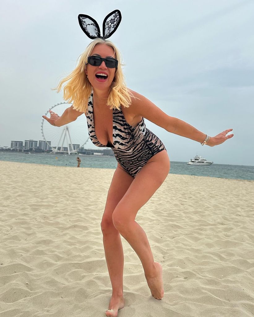 woman wearing animal print swimsuit at beach 
