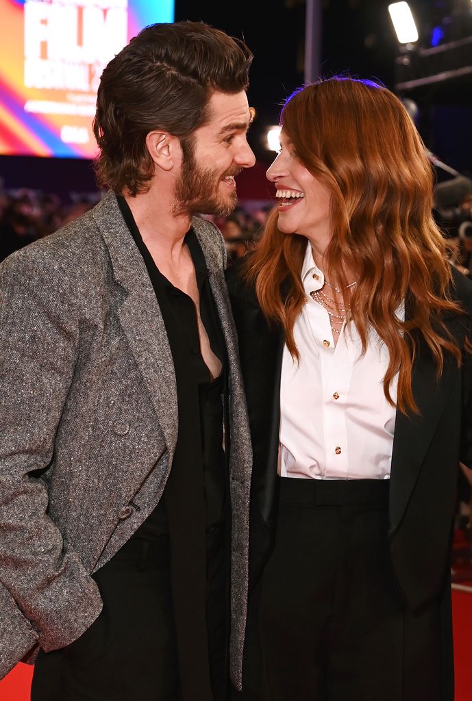 Julia and Andrew sharing a joke on the red carpet 