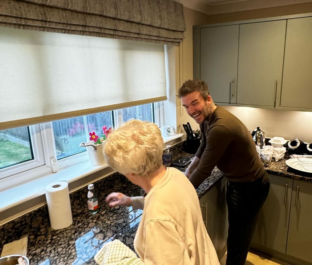 David Beckham doing the washing up at mum Sandra's home