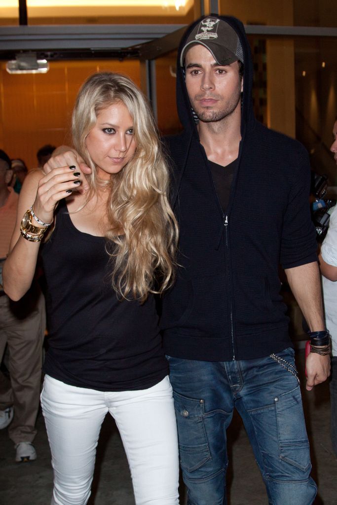 Anna Kournikova and Enrique Iglesias leave the Orange Carpet for the Miami Dolphins versus New York Jets game at Sun Life Stadium on September 26, 2010 in Miami, Florida.