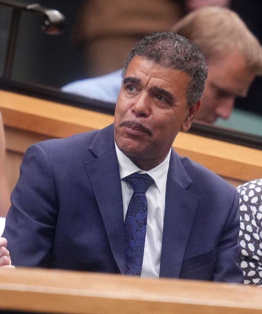 Chris Kamara in the Royal Box in navy suit