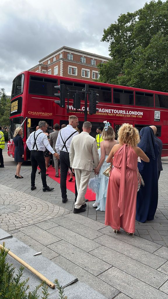 Guests getting ready to get on the party bus after Mel B's wedding ceremony