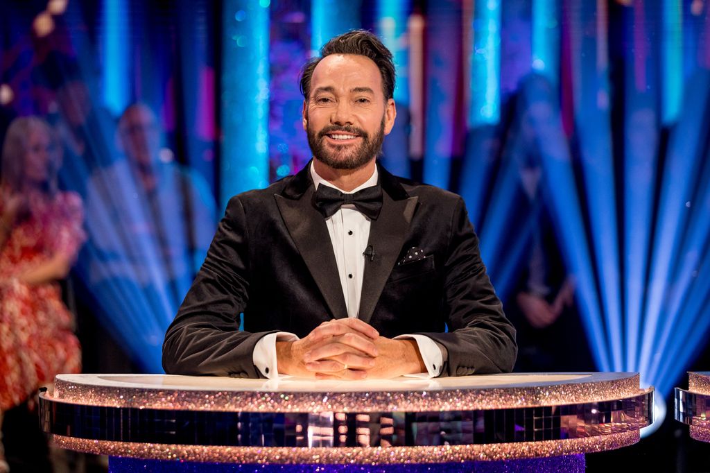 Craig Revel Horwood at a judging table