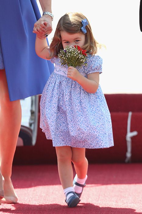 princess charlotte smells flowers