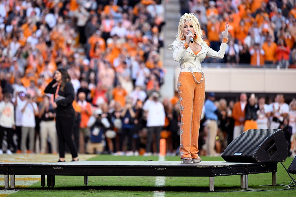 Dolly Parton speaks to the crowd between the first and second quarter at Neyland Stadium on November 18, 2023 in Knoxville, Tennessee.