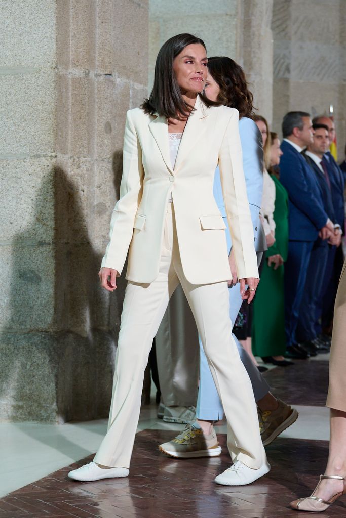 Queen Letizia in a white suit look with lacy cami
