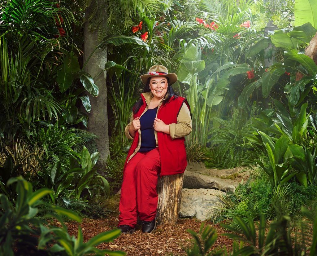 person in red and beige uniform in jungle setting