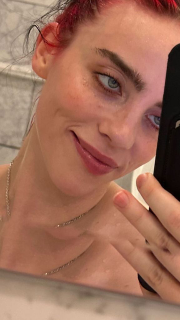 Billie Eilish shows off her fiery red hair in selfies from the shower shared on Instagram