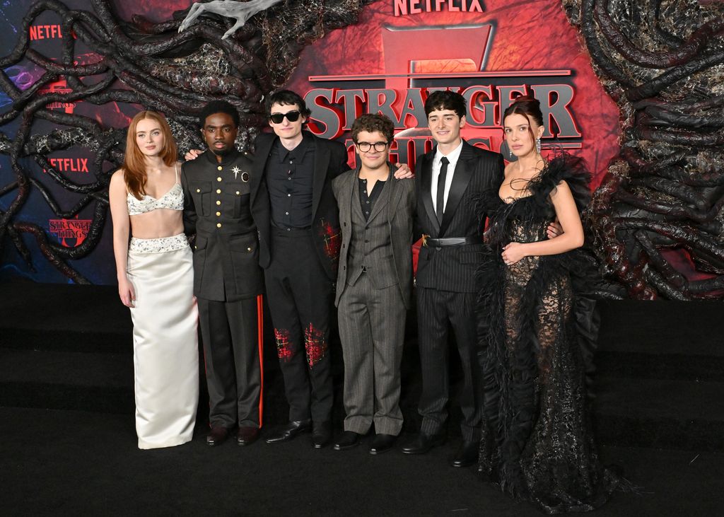 photo of Sadie Sink, Caleb McLaughlin, Finn Wolfhard, Gaten Matarazzo, Noah Schnapp and Millie Bobby Brown at stranger things season 5 premiere