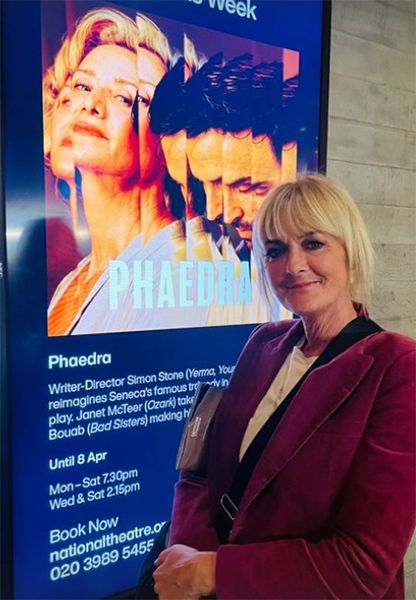 Jane Moore stood in front of theatre poster