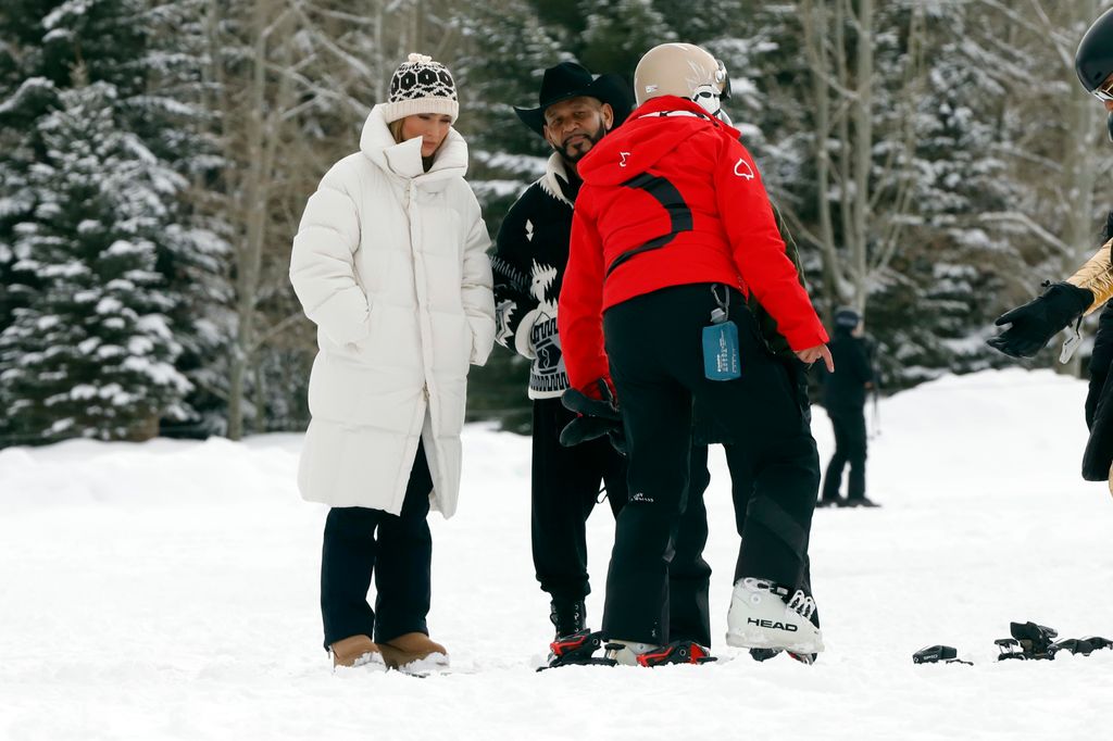 Jennifer Lopez in a white coat in Aspen