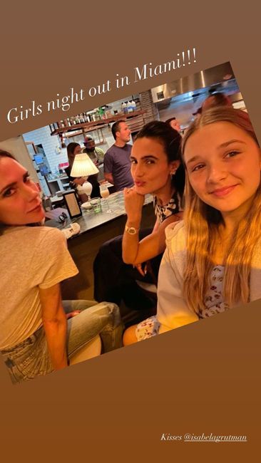 eleven year old harper takes a selfie in a restaurant with victoria and isabela