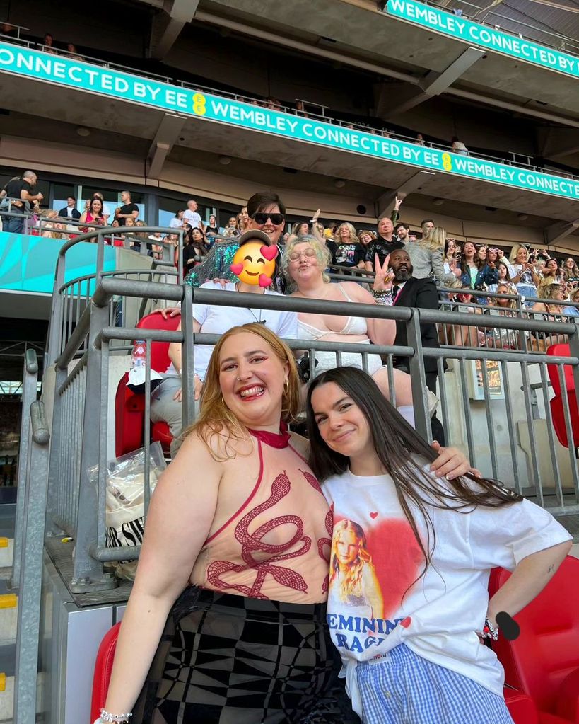 Two women hugging at the era's tour