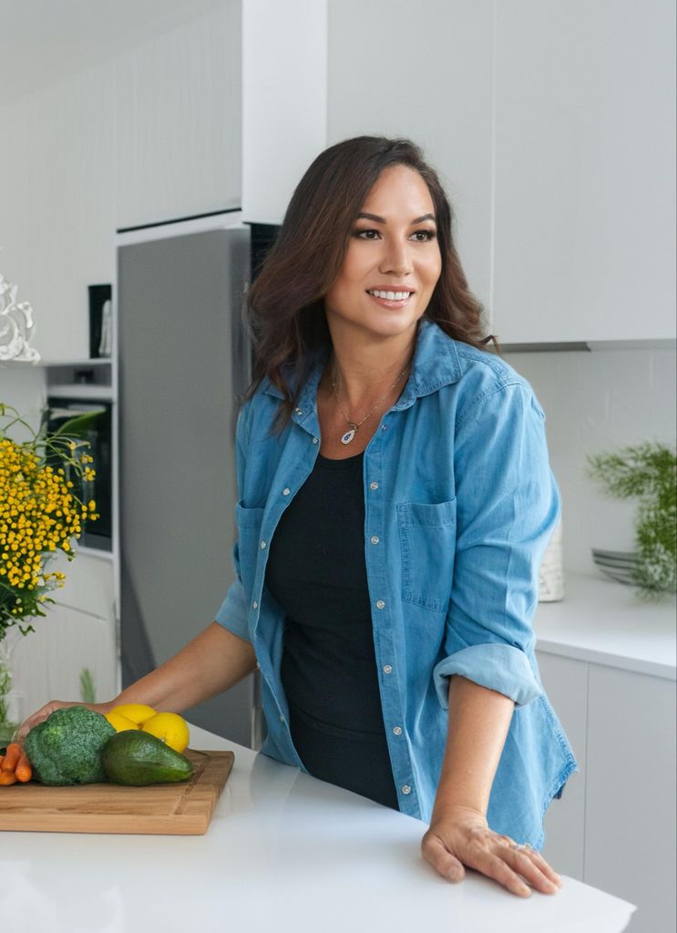 Nutritionist Faye James in  a kitchen wearing a black top and denim shirt