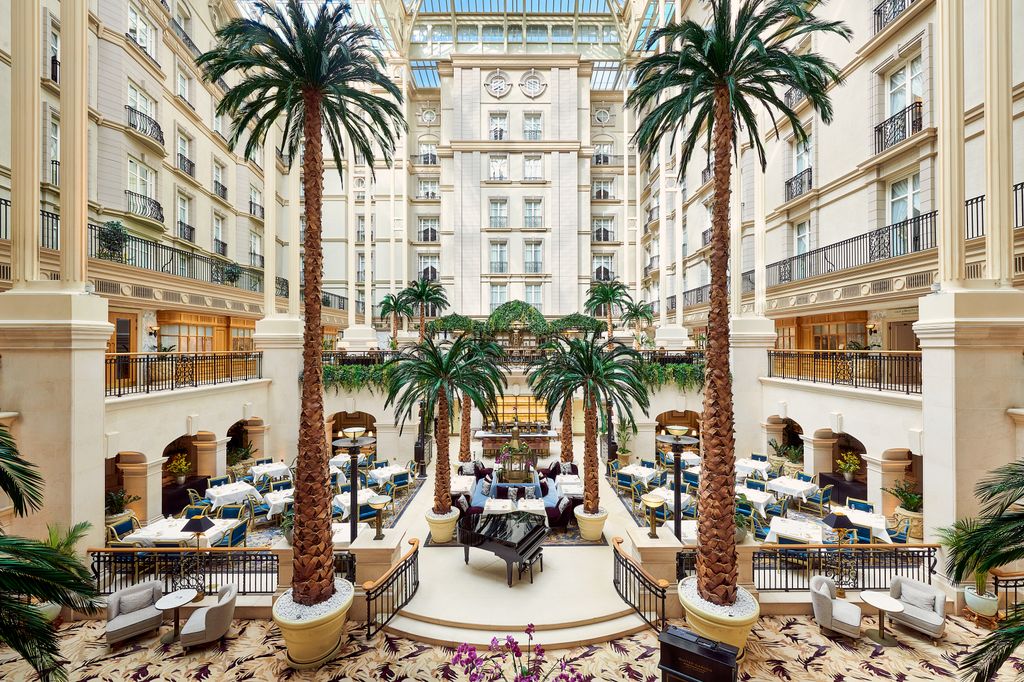 The Landmark London's picturesque atrium with high palm trees