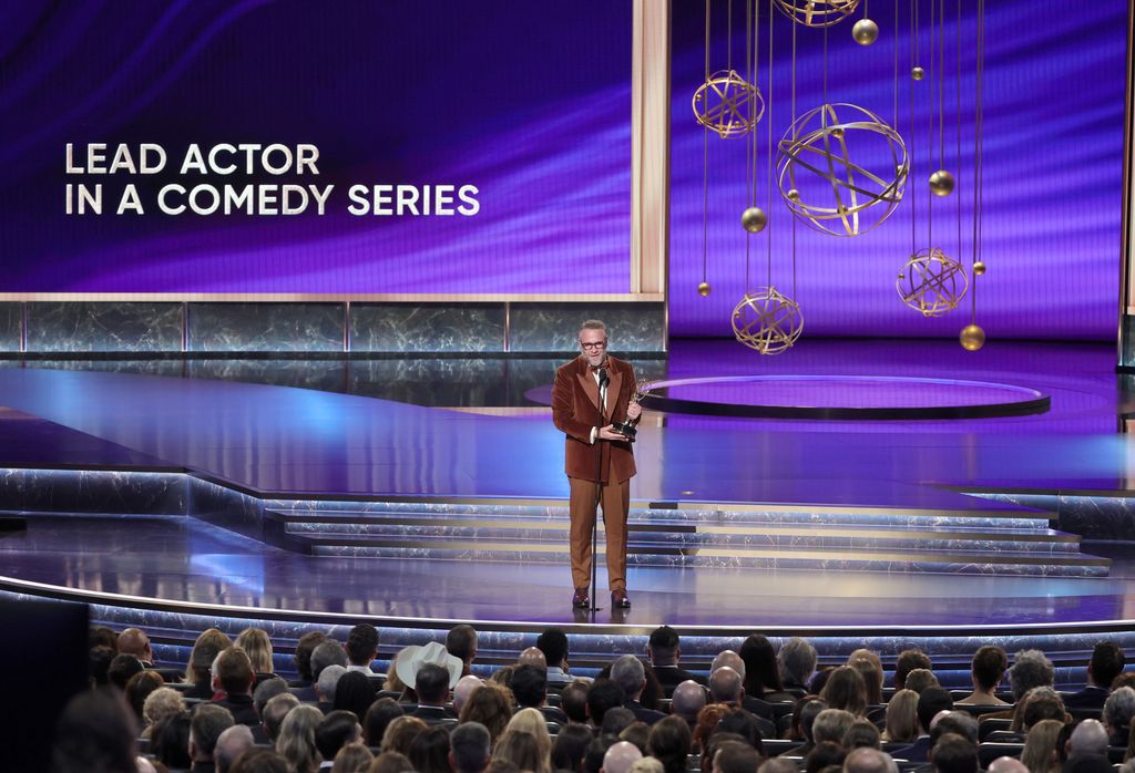 Seth Rogen accepts the Outstanding Lead Actor in a Comedy Series award for "The Studio" onstage during the 77th Primetime Emmy Awards at Peacock Theater on September 14, 2025 in Los Angeles, California