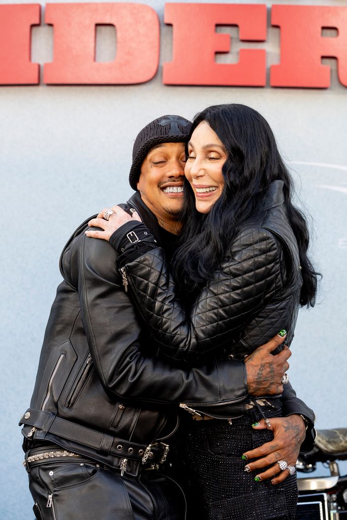 HOLLYWOOD, CALIFORNIA - JUNE 17: (L-R) Alexander Edwards and Cher attends the Los Angeles premiere of Focus Features 'The Bikeriders' at TCL Chinese Theatre on June 17, 2024 in Hollywood, California. (Photo by Emma McIntyre/WireImage)