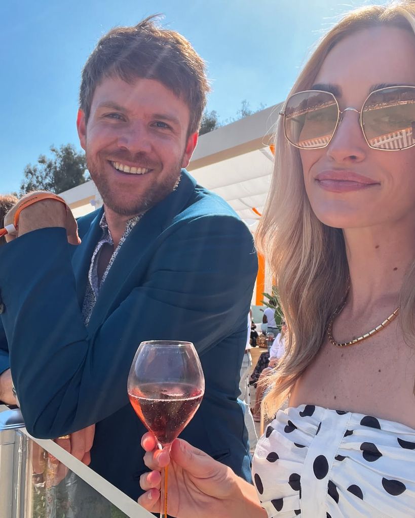 Brianne and Matt raise a glass at sunshine filled event
