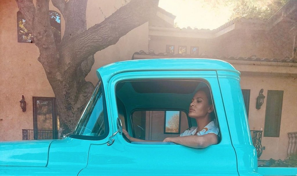 Photo shared by Eva Mendes on Instagram April 2023 of her sitting in a truck outside of her California home