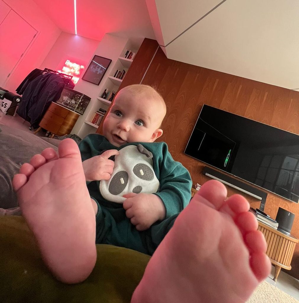 baby Jesse with feet near camera