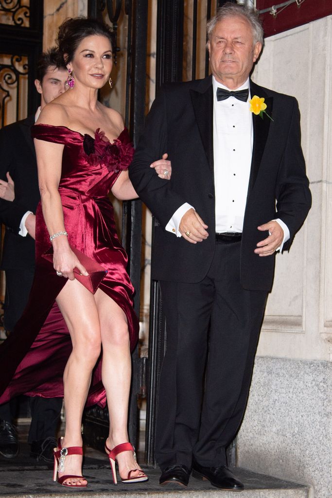 Catherine Zeta Jones in a red gown with her father David Jones 
