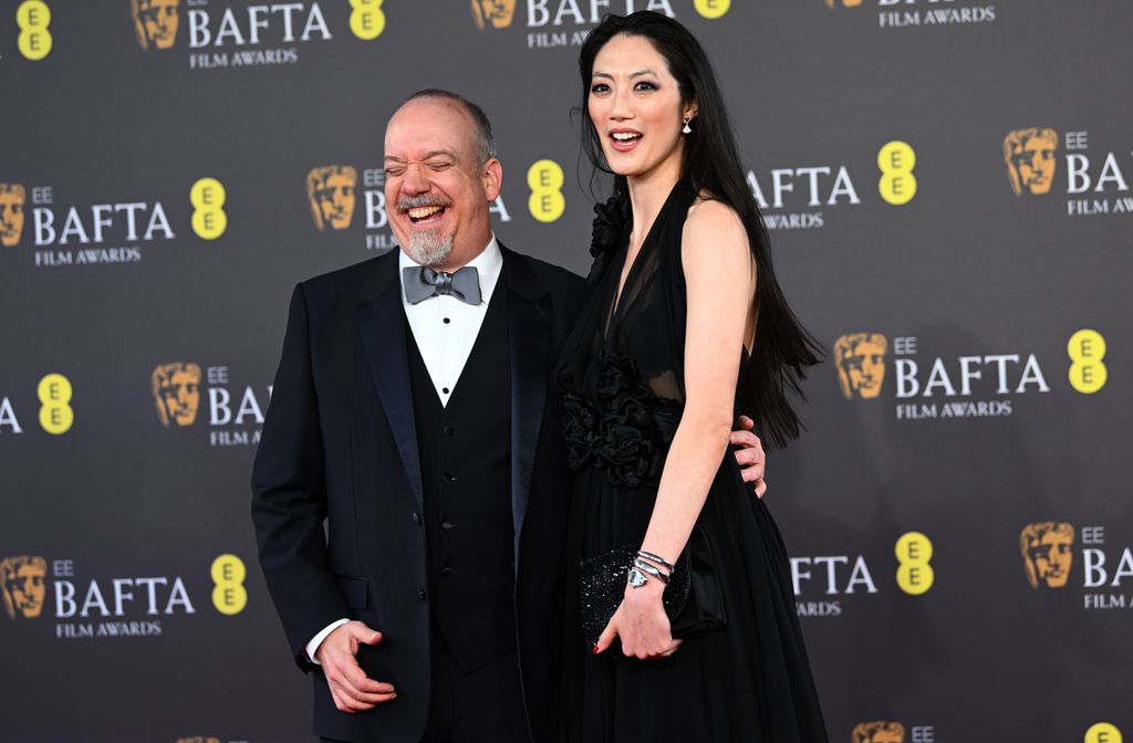 Paul Giamatti and Clara Wong attends the EE BAFTA Film Awards 2024 at The Royal Festival Hall on February 18, 2024 in London, England