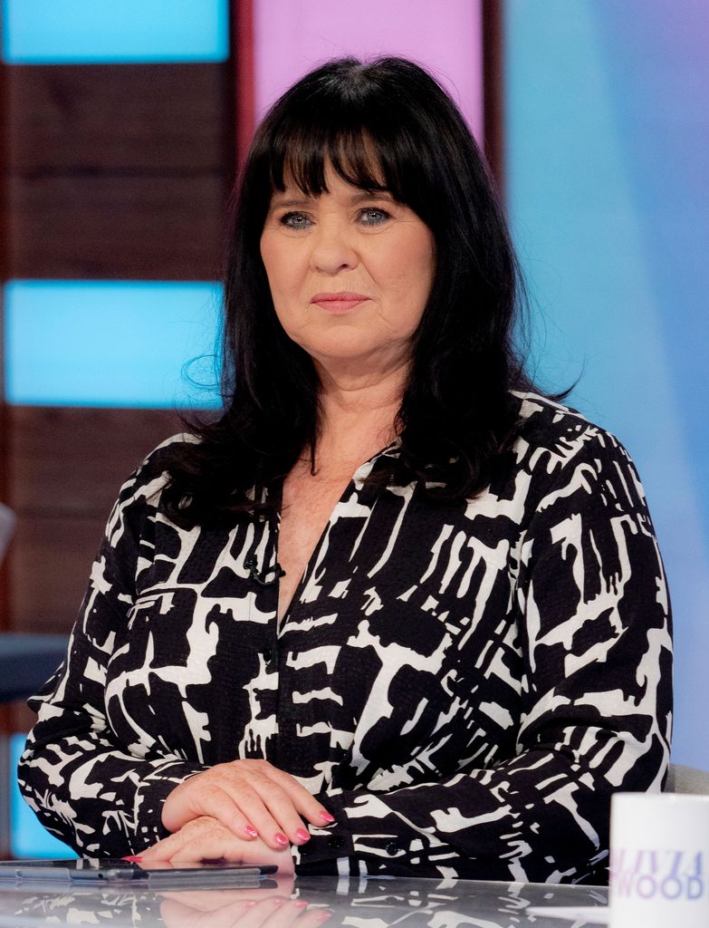 Coleen Nolan in black and white shirt