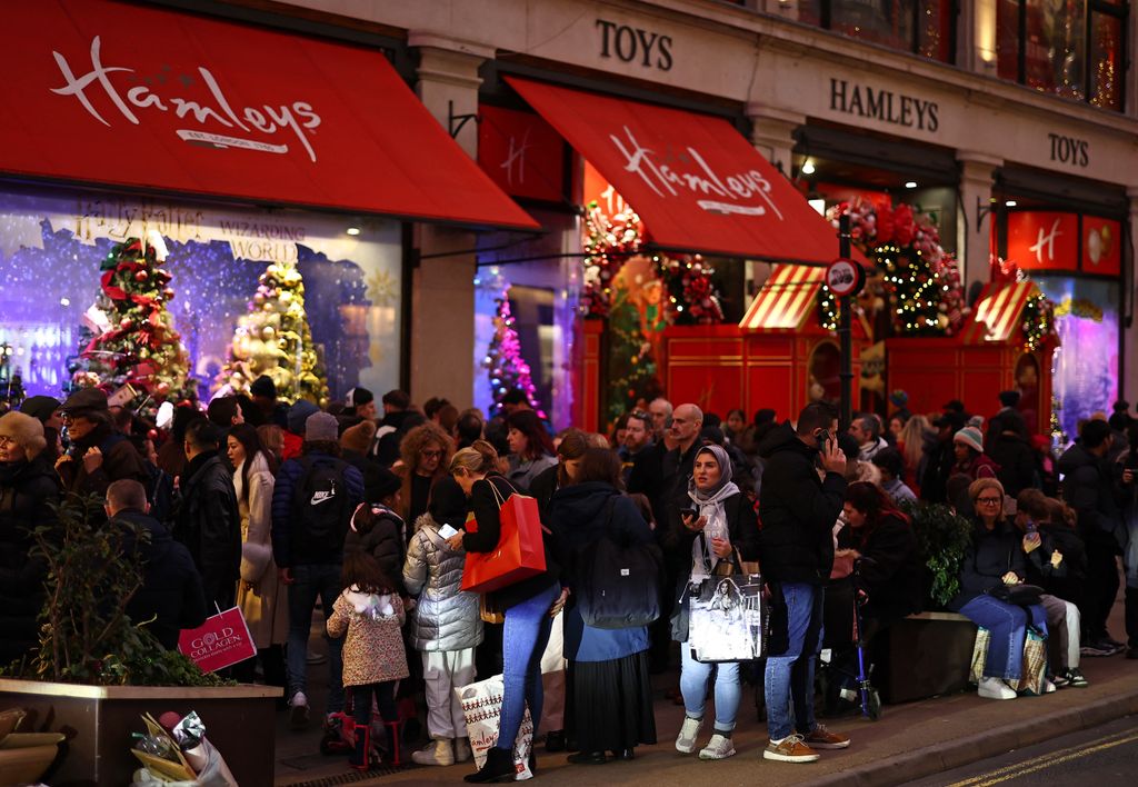 Shoppers walk past Hamleys top shop on Regent Street 