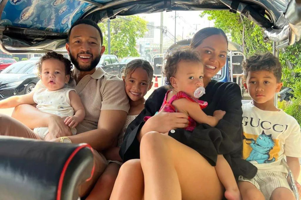 Chrissy, John, and their four kids on holiday in Thailand