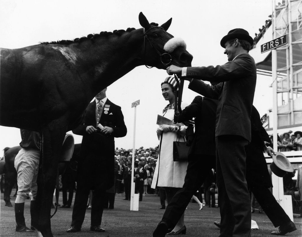 Ian Balding pictured standing to the right of Queen Elizabeth II