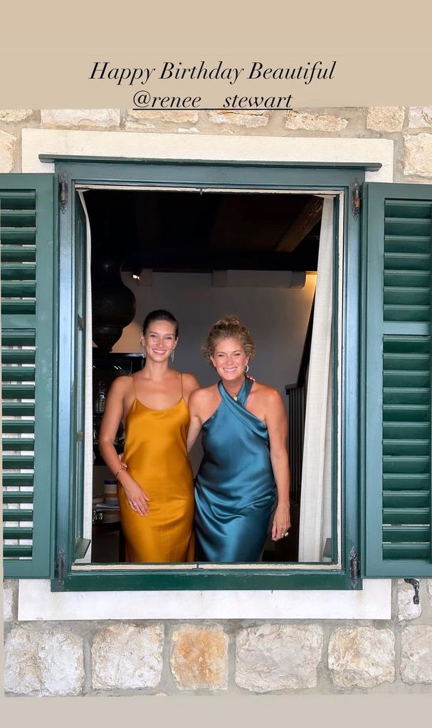 Rachel Hunter and her daughter, Rennee posing in a window 