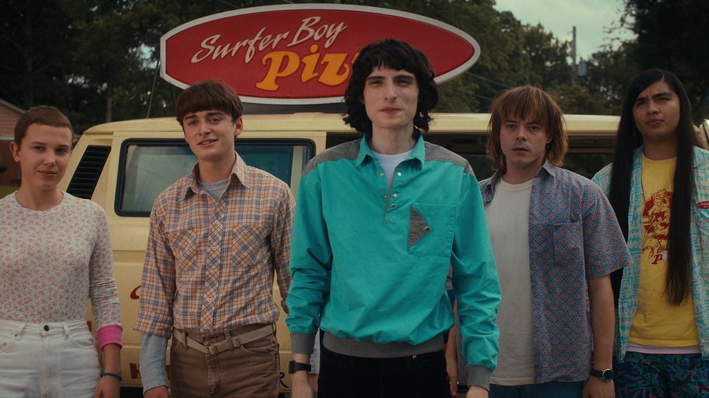 Mike, Eleven, Will and Jonathan standing in front of the Surfer Boy Pizza van