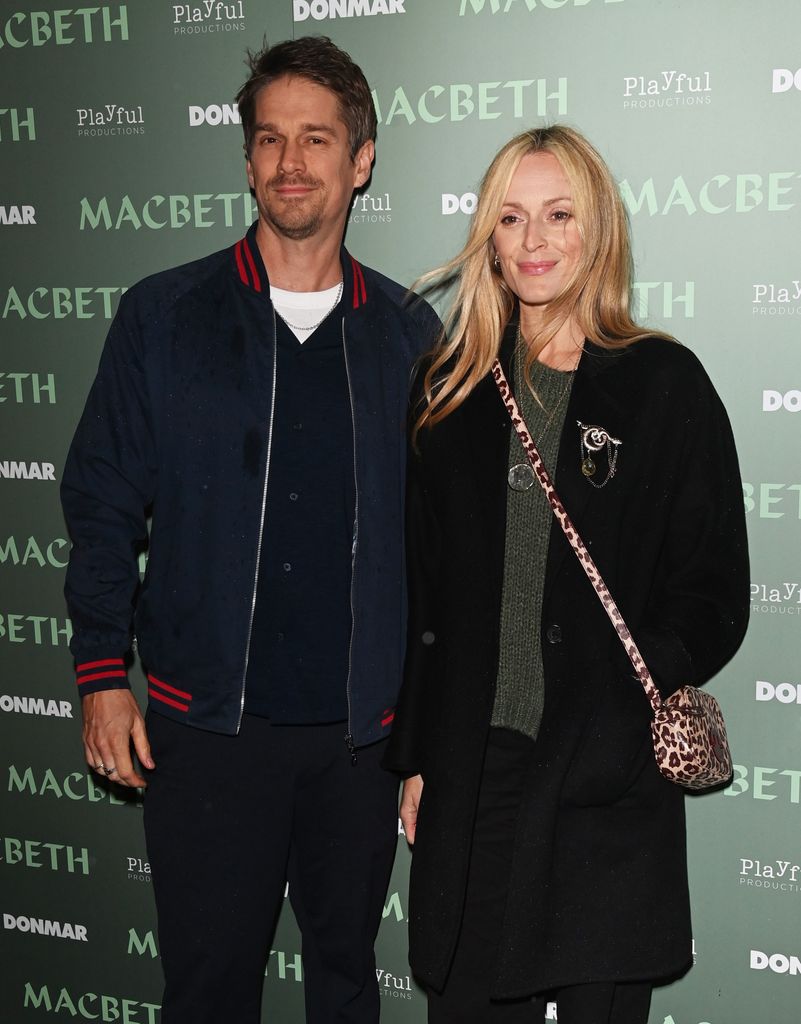 Jesse Wood standing with Fearne Cotton at a premiere