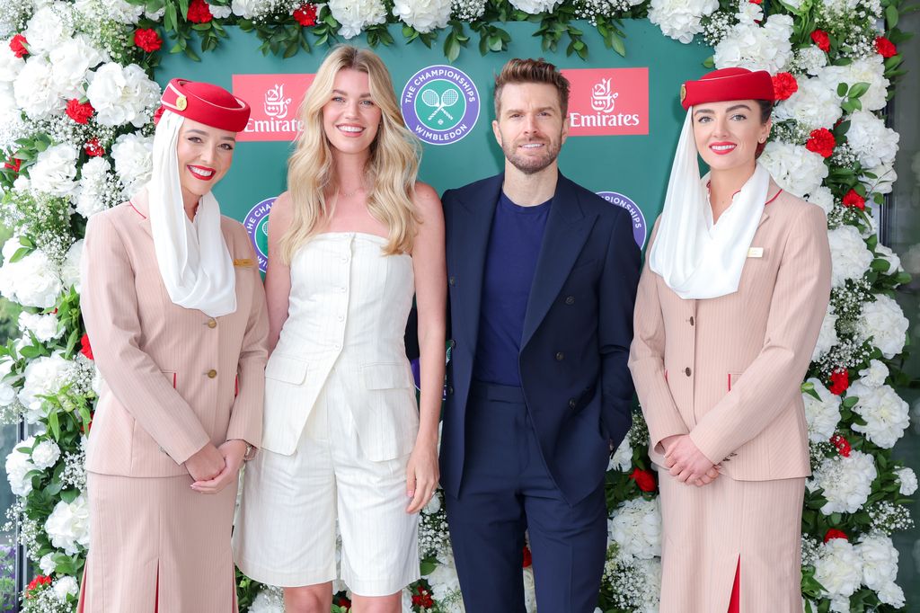 Hannah Cooper and Joel Dommett with two Emirates stewardesses