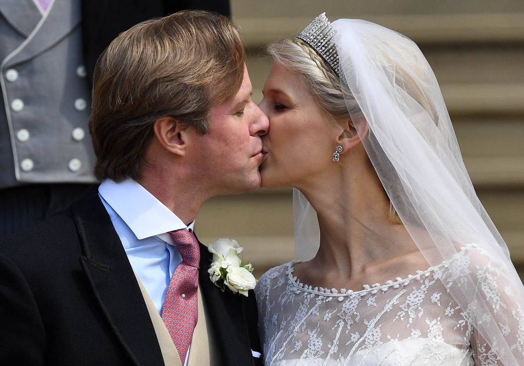 Lady Gabriella Windsor and Thomas Kingston share a kiss on the steps after marrying in St George's Chapel 