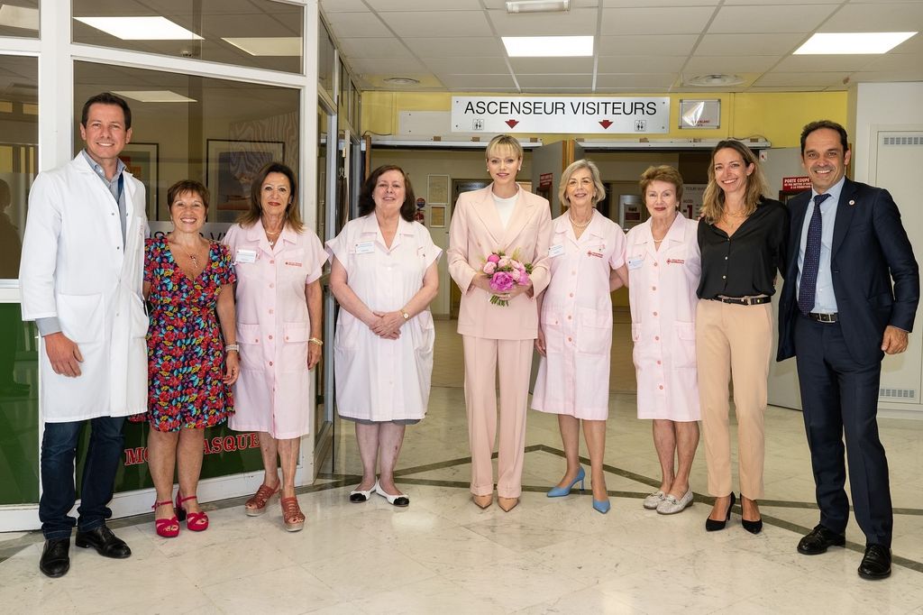 Princess Charlene in a pink suit to visit a hospital