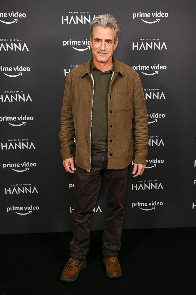 Dermot Mulroney in a brown jacket and jeans 