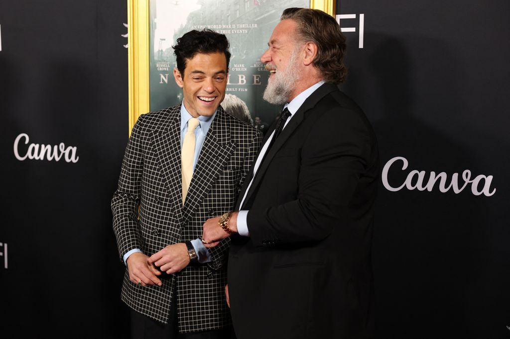 US actor Rami Malek (L) and New Zealand-Australian actor Russell Crowe attend the AFI premiere of "Nuremberg" at the TCL Chinese Theatre in Hollywood, California on October 24, 2025