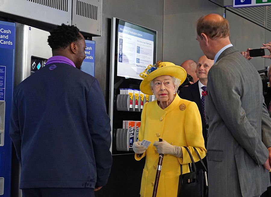the queen holding oyster card