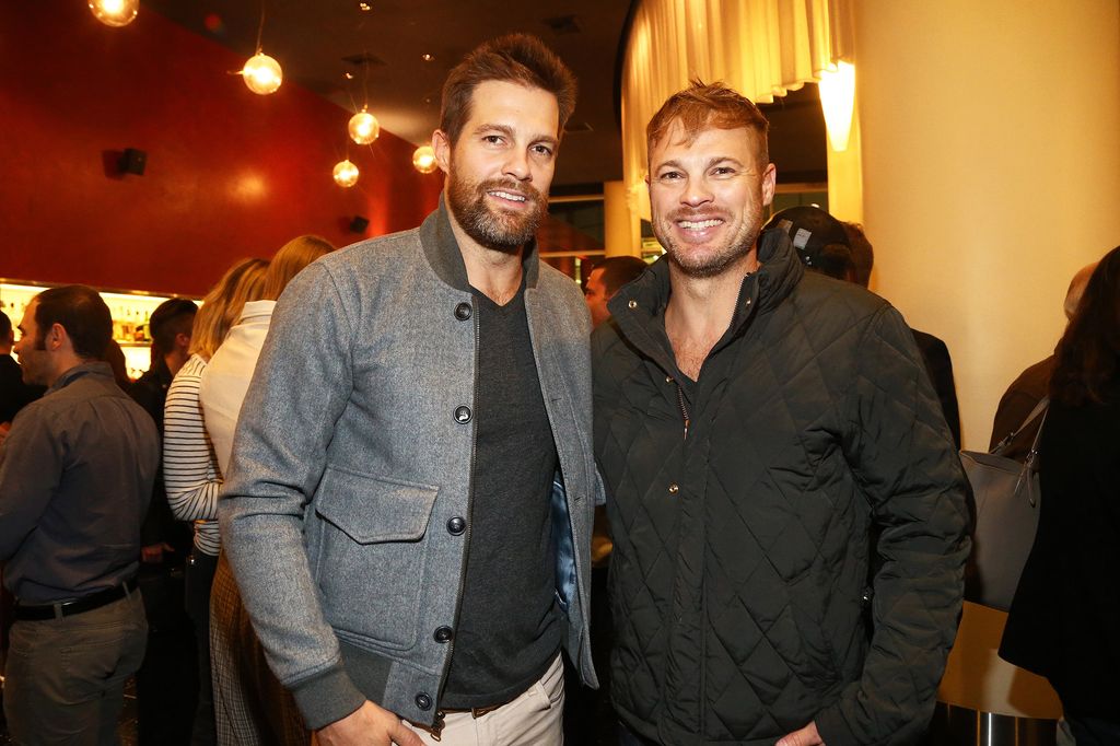 Geoff Stults and George Stults smiling alongside one another 