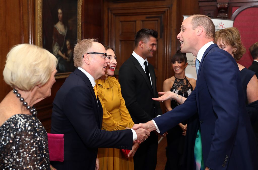 Prince William, Duke of Cambridge greets Jason Watkins as he attends the Child Bereavement 25th birthday gala dinner at Kensington Palace 