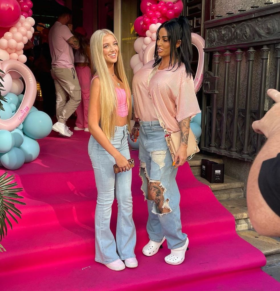 Princess and Katie pictured together in front of pink balloons 