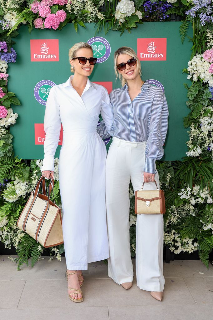 eliza spencer in white dress and amelia in striped shirt and white trousers