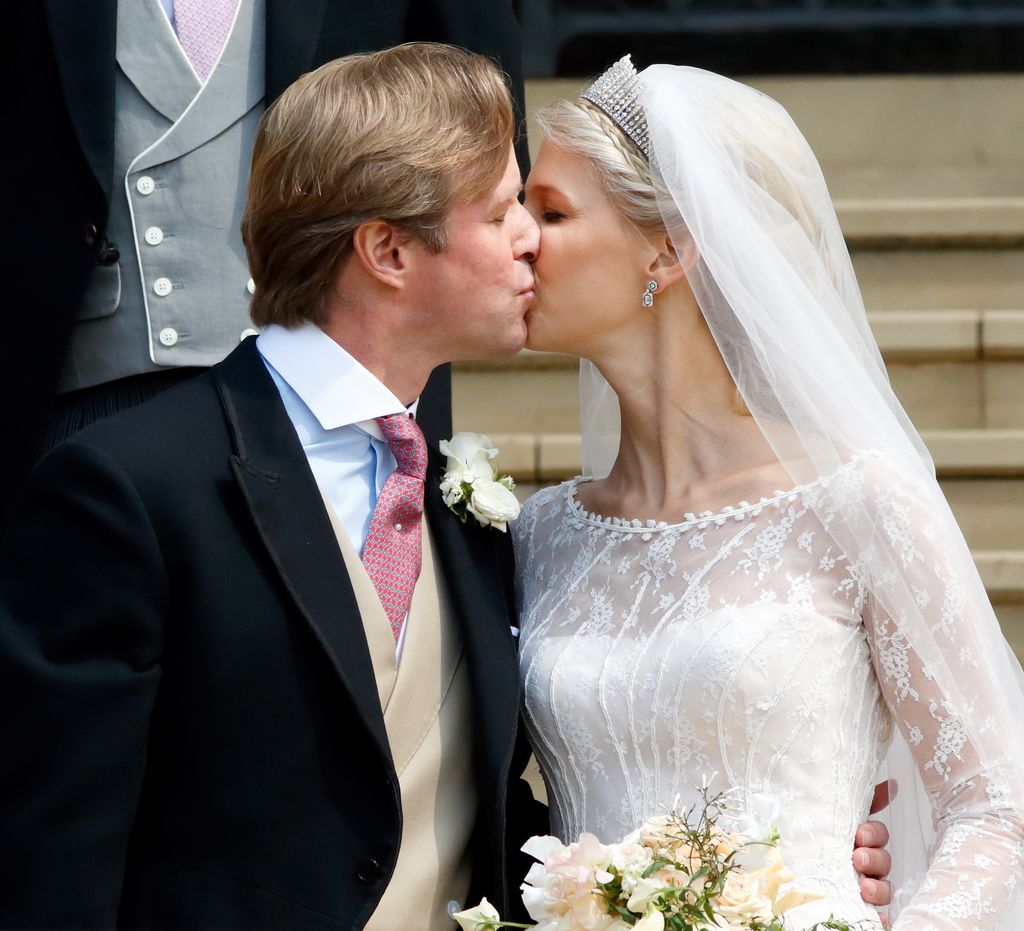 The bride and groom share a kiss on their wedding day