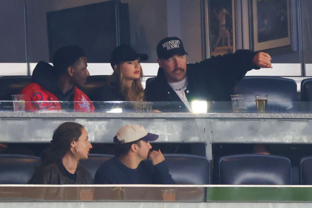 Taylor and Travis attended the baseball game with Adam in October