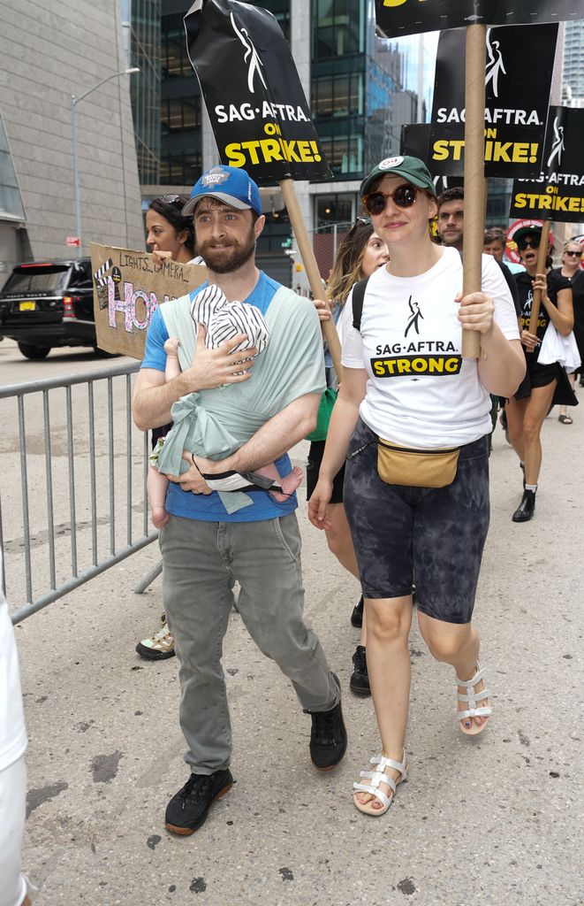 Daniel Radcliffe and Erin Darke join the picket line In New York City on July 21, 2023 in New York City. Members of SAG-AFTRA, Hollywood's largest union which represents actors and other media professionals, have joined striking WGA (Writers Guild of America) workers in the first joint walkout against the studios since 1960. The strike could shut down Hollywood productions completely with writers in the third month of their strike against the Hollywood studios.