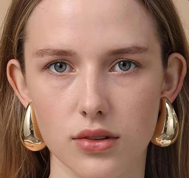 A looklike pair of Amazon Extra Large Earrings in gold
