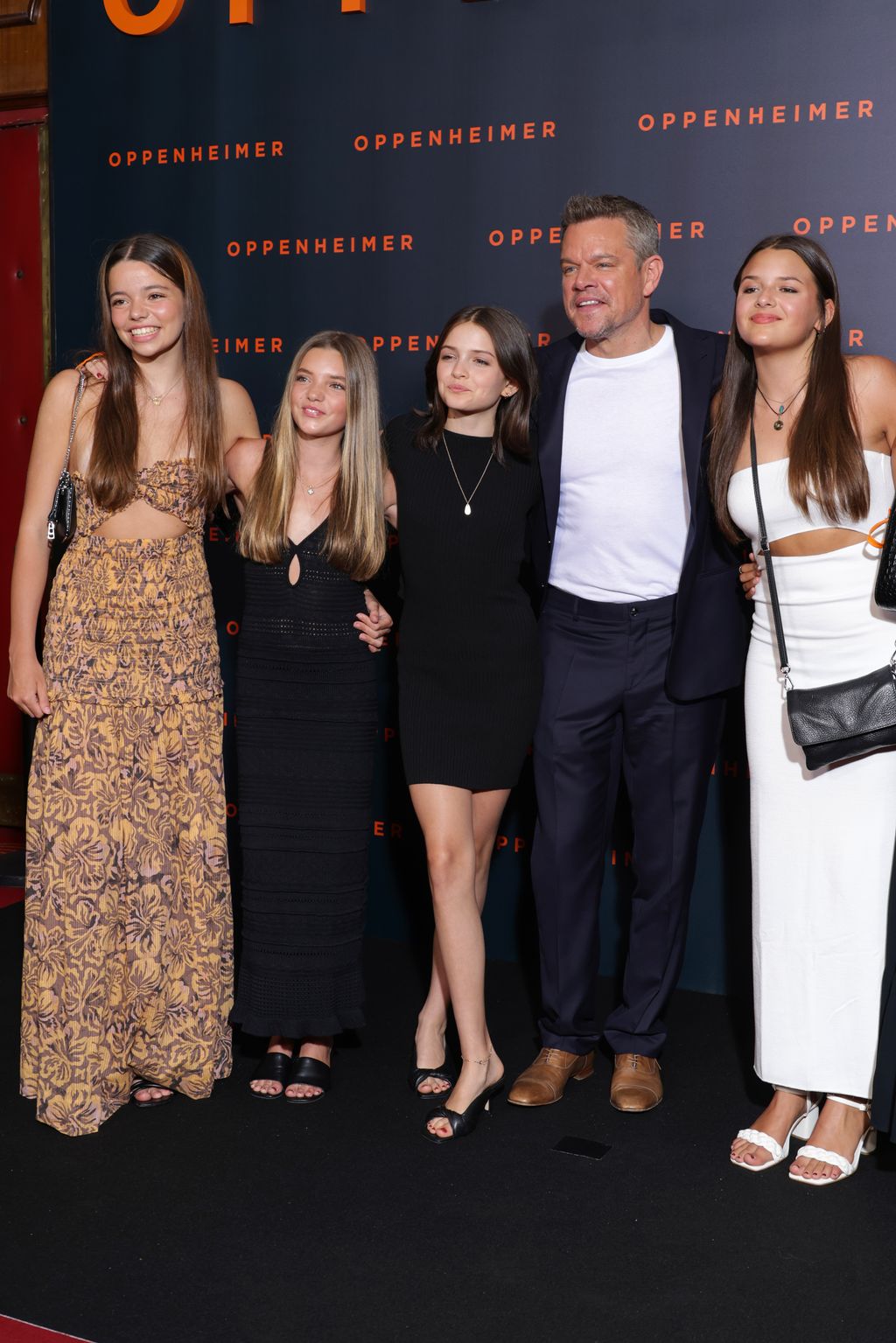 Matt Damon with his daughters Alexia Damon, Isabella Damon, Gia Damon and Stella Damon attend the "Oppenheimer" premiere at Cinema Le Grand Rex on July 11, 2023 in Paris, France