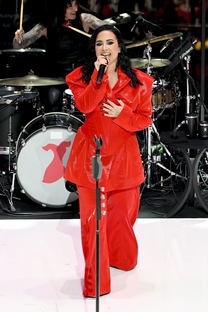 Demi Lovato performing onstage at the star-studded fundraiser 