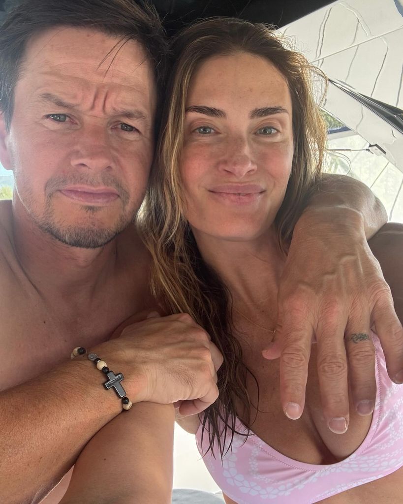 mark wahlberg topless with arm around wife rhea wearing a bikini